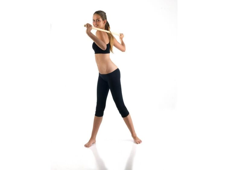 Exercise with a stick to strengthen and develop back muscles in thoracic osteochondrosis